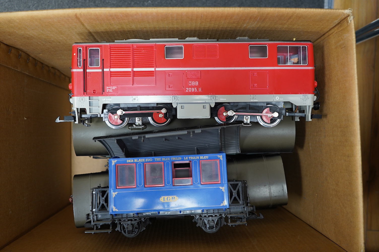 Ten Lehmann LGB G scale railway items; an OBB Bo-Bo diesel locomotive, an 0-4-0T locomotive, five bogie coaches and three 4-wheel coaches. Condition - fair, running wear and possible minor damage.